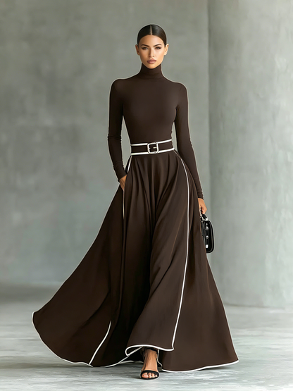 Vestido Maxi Negro con Costuras Blancas, Cuello Alto, Manga Larga y Cintura Entallada
