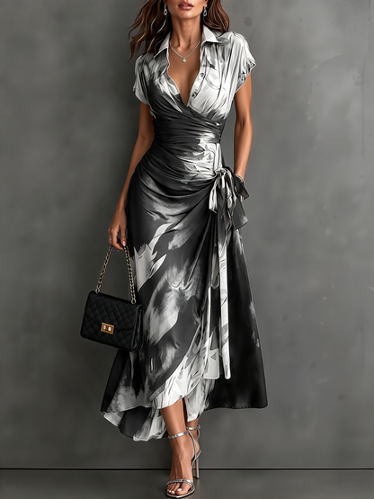 Vestido Midi Cruzado Abstracto Rojo y Negro con Cuello Camisero, Escote en V, Manga Corta, Cintura Anudada y Bajo Asimétrico con Volante