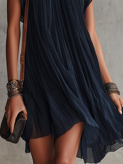 Tamara | Vestido corto de gasa plisada azul navy con bordados florales