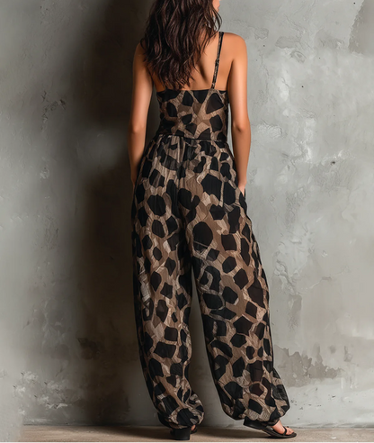 Roberta | Mono amplio de gasa negra con estampado animal print, escote halter y pantalón palazzo